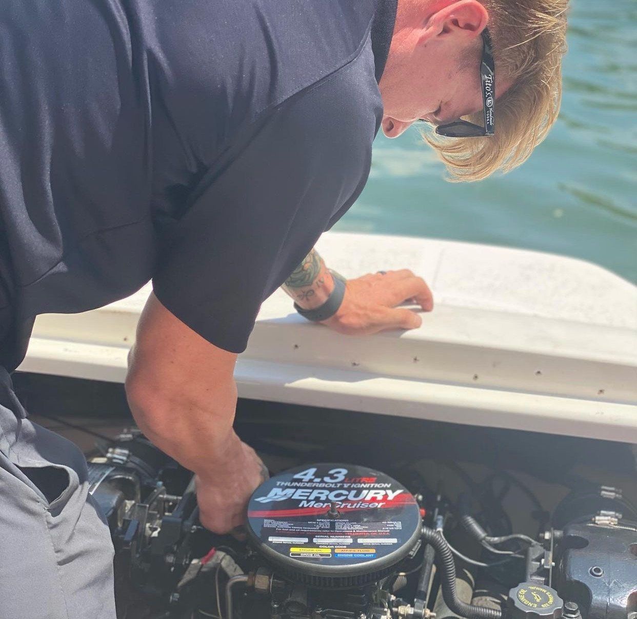 Technician servicing a Mercury outboard