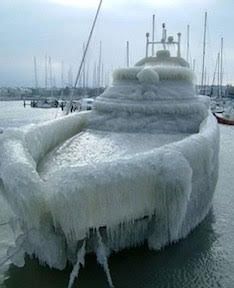 Ice-covered boat showing freeze damage risk